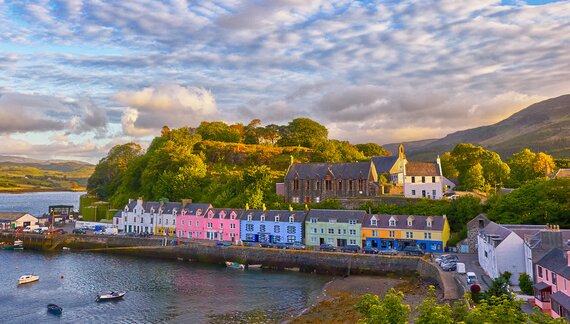 Brightly painted houses of the town of Portree before sunset, on the Isle of Skye, Scotland, UK
